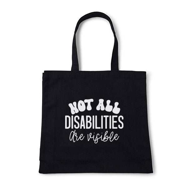 Black tote bag with 'Not all disabilities are visible' text on a white background